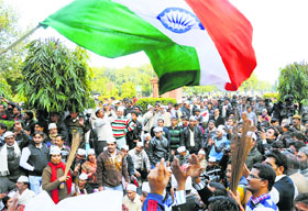 AAP supporters during a dharna near Parliament demanding action against police personnel for their alleged dereliction of duty in New Delhi