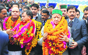CM Virbhadra Singh being welcomed by local residents at Kotli in Mandi on Thursday.