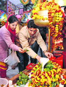 Devotees offer bel patra to a Shivalingam in a Jammu temple on Thursday. Tribune Photo: Anand Sharma 