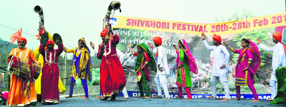 Artistes perform on the second day of the Mahashivratri mela in Ransoo, the base camp of the Shiv Khori cave shrine in Reasi district. A Tribune photograph