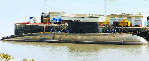 Back to base INS Sindhuratna is docked at the Naval Dockyard in Mumbai on Thursday after fire broke out in one of its compartments, killing two officers.