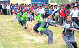 Girl students take part in tug of war on the concluding day of the athletics meet at the GKU in Talwandi Sabo on Friday.