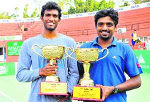 N Sriram Balaji and Ranjeet Virali with their trophies after winning the mens double title of the DLF-ITF Mens Futures US $10,000 Tennis Tournament in Chandigarh on Friday.  