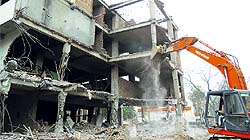 The demolition of a building owned by Deputy Mayor Yashpal Batra under way as part of an anti-encroachment drive of the municipal corporation in Gurgaon on Friday