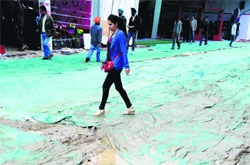 Muddy premises of the venue caused inconvenience to visitors. Tribune photo: Himanshu Mahajan