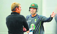 Michael Clarke shares a point with Shane Warne. Reuters
