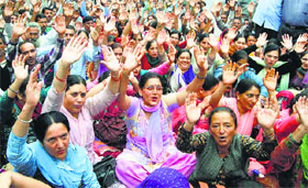 Government employees stage a protest outside the Himachal Secretariat in Shimla