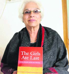 Author and sociologist Supriya Singh poses with her book, Girls Ate Last  Partition, education and life of Inder Kaur in Amritsar
