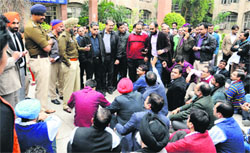 Members of the Indian Medical Association (IMA) hold a protest outside the District Administrative Complex.