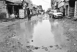 A damaged road at Balongi village, near Mohali, on Saturday. Tribune photo: Parvesh Chauhan