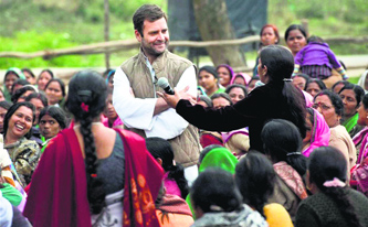 Rahul Gandhi with aanganwadi workers at Chinhat in Lucknow on Friday.