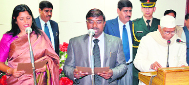 Governor Jagannath Pahadia administers the oath of office and secrecy to Neelam Singh and Rajesh Vaid as members of the HPSC at New Delhi on Saturday.