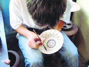 An artist at work in Rishtan