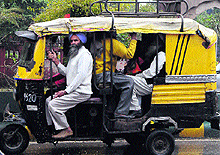 An auto-rickshaw ferrying more than six passengers