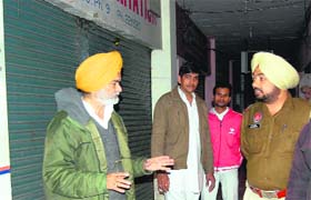 Victim Col Sardole S Sidhu (retd) interacts with a police official at Phase IX in Mohali on Sunday