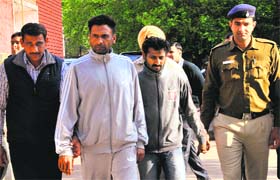 The accused in police custody at Sector 11, Chandigarh, on Sunday