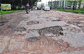 A potholed road in Sector 50