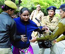 Police personnel carry a visually challenged activist during a protest against the Ordinance on the Rights of Disabled outside the PMs residence in New Delhi on Sunday