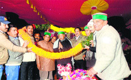 Chief Minister Virbhadra Singh being garlanded by party workers at Nihri in Sundernagar on Sunday.