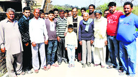 BJP state president Satpal Singh Satti with people at Bhadolian Khurd village in Una on Sunday.