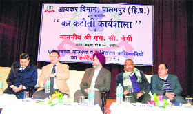 A seminar organised by the Income Tax department in progress in Palampur.