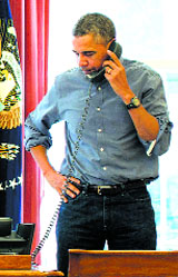 US President Barack Obama talks with Russian President Vladimir Putin on Saturday.