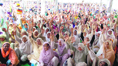 Women activists raise slogans during the bhog ceremony of farmer Bahadur Singh in Bandala village (Amritsar) on Sunday. 
