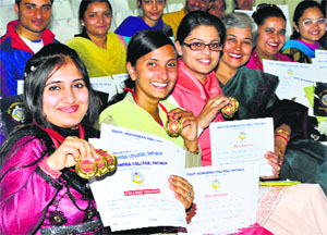 Students display their medals during the annual function of Government Mohindra College in Patiala on Sunday. 