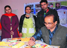 3D mural artist Bharat Rawal works on his murals at a workshop conducted by him in Amritsar on Monday