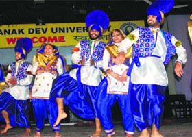 Students perform bhangra at Jashan-2014 at Guru Nanak Dev University in Amritsar