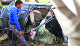 The remains of the mangled car which collided head-on with a canter on the Malout-Bathinda-Barnala Road on Monday.