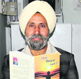 Jagmel Singh Jathol with his book in Bathinda.