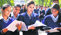 Students discuss their question paper after appearing for the first CBSE Class X examination at DAV School, Sector 15, Chandigarh, on Monday. Tribune photo: Pradeep Tewari 