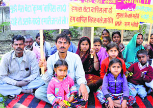 Parents and relatives of a missing boy stage a dharna in Karnal on Monday