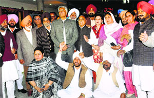 Congress MLAs led by Leader of Opposition Sunil Jakhar (centre) raise slogans after a walkout from the Assembly on Monday