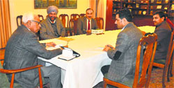 Governor NN Vohra with a delegation of university teachers in Jammu. a tribune Photograph