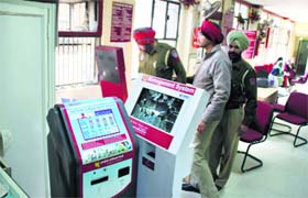 The police look for a clue at the PNB branch in Ludhiana where the theft took place