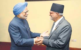 PM Manmohan Singh greets his Nepalese counterpart Sushil Koirala at Nay Pyi Taw, Myanmar, on Monday