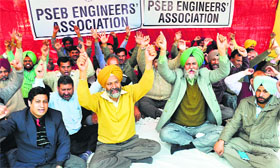 Members of the PSEB Engineers Association protest in Patiala on Monday.
