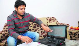 Raghav Gupta, a student of the Vellore Institute of Technology, Vellore, shows the traffic management system he came up with in Bathinda on Tuesday.