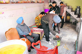 Health Department officials collect samples from Ashok Dairy in Bathinda on Tuesday.