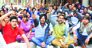 Students of the Ambedkar Institute of Careers and Courses protest on the campus at Phase 3B2 in Mohali on Tuesday