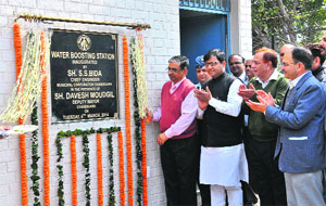 SS Bidda, MC Chief Engineer, inaugurates a water-boosting station in the presence of Deputy Mayor Davesh Moudgil at Sector 31 in Chandigarh on Tuesday. 