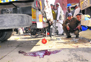 Police investigate at the spot of an accident in Sector 26, Chandigarh, on Tuesday