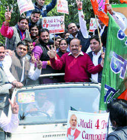 BJP Delhi Pradesh president Dr Harsh Vardhan flags off a car rally to kick off the Modi for PM campaign at the party office in New Delhi on Tuesday.