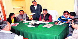 Mayor Manoj Garg consults councillors at his office regarding the tax to be levied on hotels in Haridwar on Tuesday