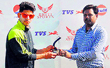 Dipankar of the Rao Cricket Academy receives the man of the match award at the Pepsi Cricket Tournament in Dehradun on Tuesday