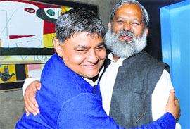 MLA Naresh Sharma hugs BJP MLA Anil Vij, who was suspended from the Vidhan Sabha, in Chandigarh on Tuesday.