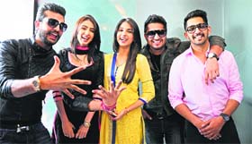 The star cast of Punjabi movie "Mr and Mrs 420" poses for a photograph during the promotion of their film in Ludhiana
