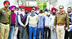 The accused in police custody in Ludhiana on Tuesday. Tribune photo: Himanshu Mahajan